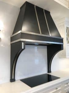 hammered polished chrome finish in dark black metal kitchen stove hood