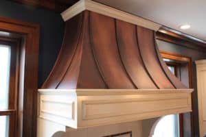 custom copper range hood with wood trim by raw urth