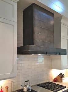 hand crafted steel range hood in antique patina by raw urth
