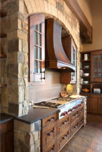 inset range hood with stone arch with steel durango by raw urth designs