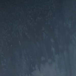 Gunmetal-3 features a dark blue and gray textured surface with subtle patterns and gradients, reminiscent of abstract paint strokes or a cloudy sky.