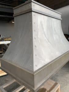 custom Montrose range hood in light washed steel
