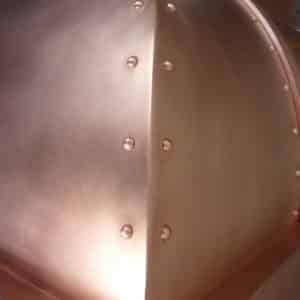 detail shot of raw copper range hood