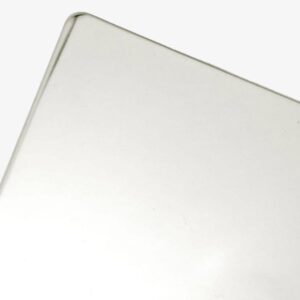 Close-up of a Polished Stainless sheet with smooth, rounded edges, photographed at an angle against a plain white background.