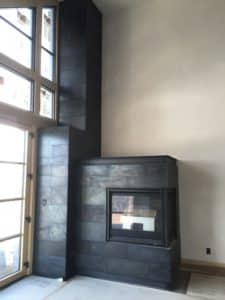 custom fireplace paneling in steel