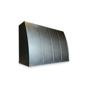 The EVG Aspen Classic FLOAT (1) is a large, curved, industrial-style metal hood with riveted panels and a dark finish, set against a plain black background, highlighting its sturdy construction and modern design.