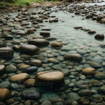 Rustic Iron Mood-2 The Rustic Iron Mood-2 captures the essence of a shallow, clear stream flowing over smooth, rounded rocks in assorted sizes, bordered by lush green grass.