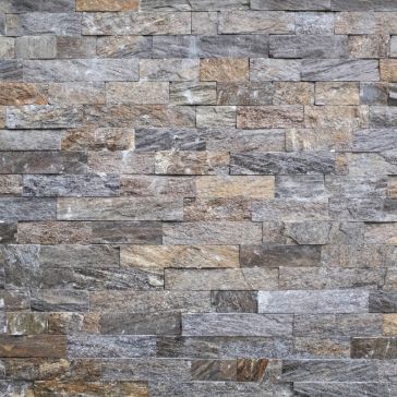 A close-up of a wall featuring Agate 4 rectangular stone tiles in varying grey and brown shades, arranged in a staggered brick pattern.