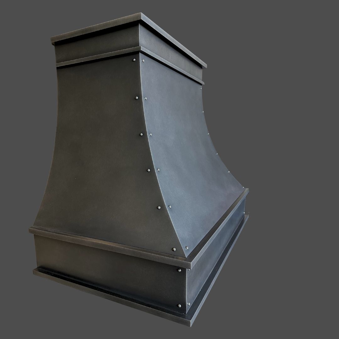 The Antique 1 is a matte black metal kitchen range hood featuring a curved center and rivet details, shown against a plain gray background.