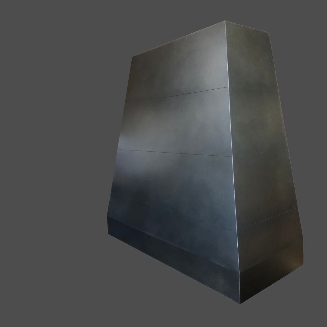 The Antique 3 is a large, dark, metallic structure with smooth surfaces and a trapezoidal shape, displayed against a plain gray background.