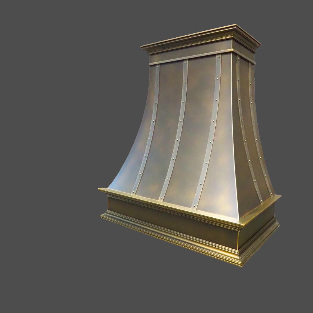 The Brass Antique 1 is a metallic kitchen range hood featuring a flared, riveted design and a brushed bronze finish, displayed against a plain gray background.