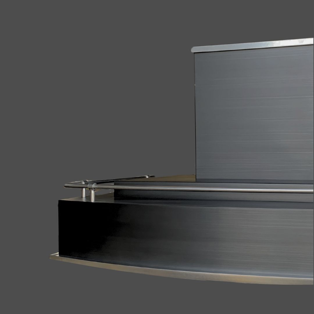 Brushed 2 The Brushed 2 is a modern metallic counter with clean lines, a raised rectangular section, and metal rail, offering a sleek industrial look against a plain grey background.