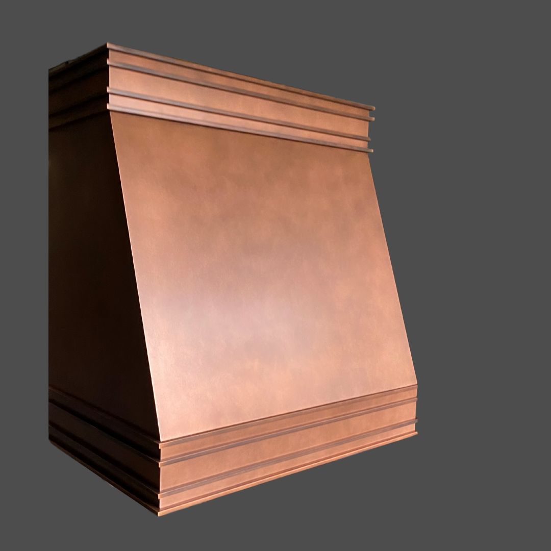 Copper Antique 3 The Copper Antique 3 is a kitchen range hood featuring a smooth, slanted front panel and horizontal trim at the top and bottom, shown against a plain gray background.