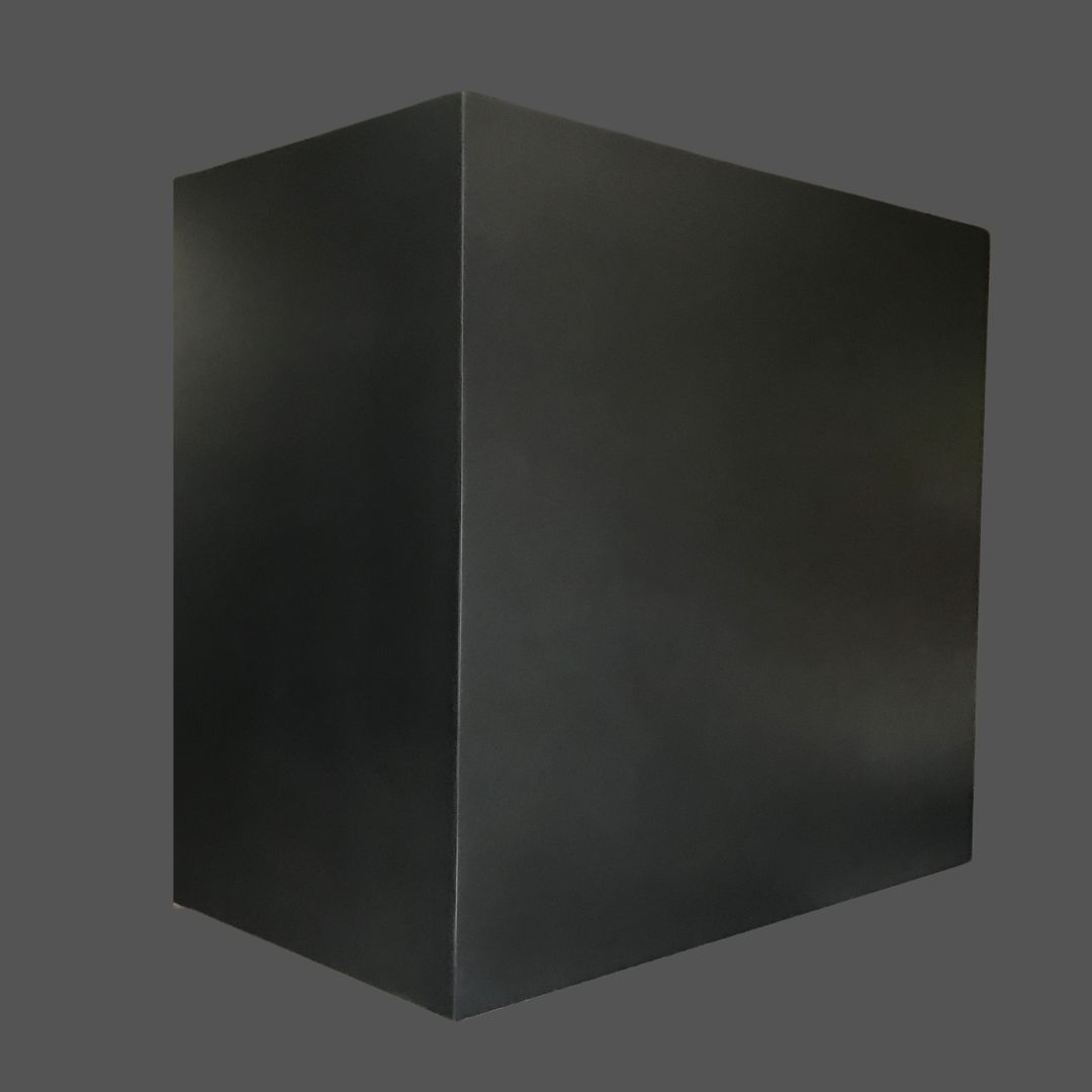 Dark Antique 1 The Dark Antique 1, a large solid black rectangular box, stands against a plain gray background as light subtly highlights its sharp edges and smooth surfaces.