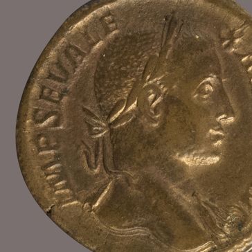 A close-up of Foundry 6378 (2), an ancient Roman bronze coin featuring a man's profile with short hair and laurel wreath, and a partial Latin inscription along the edge.