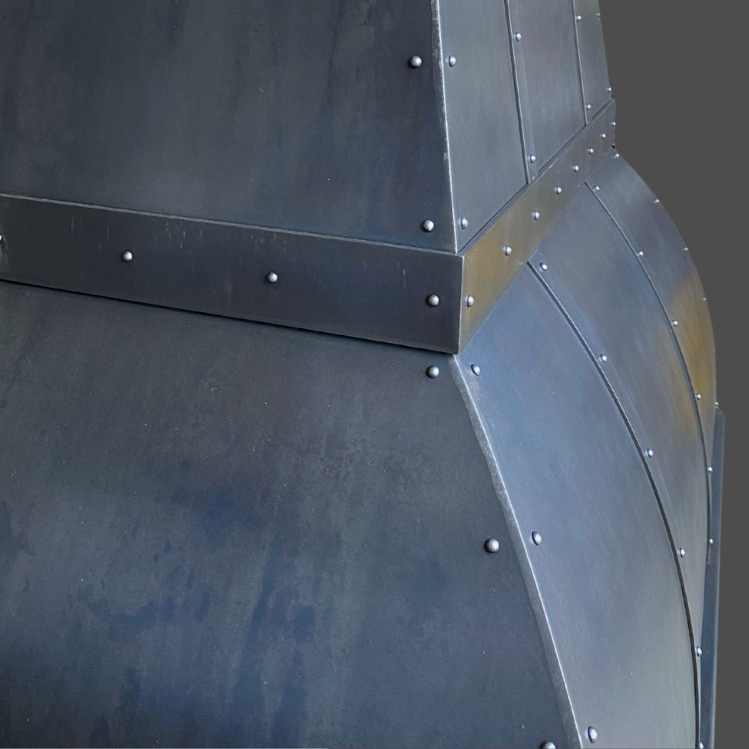Close-up of Gunmetal 2, a dark metal structure with rivets and angular panels, featuring a matte finish and subtle color variations.