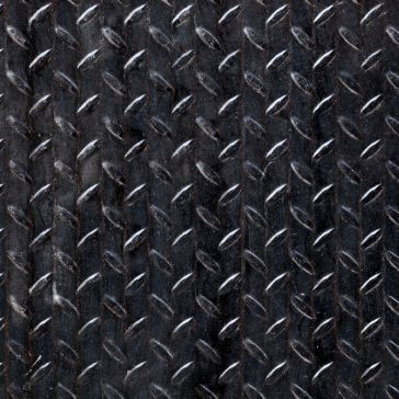 Close-up of Gunmetal 6—a dark metal diamond plate with a repeating raised, textured pattern, commonly used for industrial flooring or stairs to enhance grip.