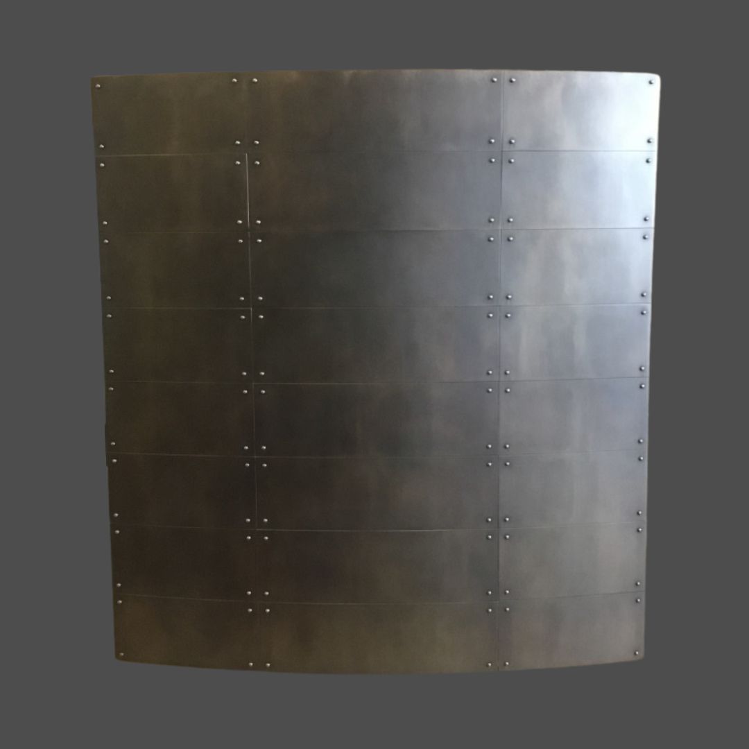 Gunnison gallery1 The Gunnison gallery1 features a large, curved metal panel composed of several rectangular sections with visible rivets, displayed against a plain gray background.