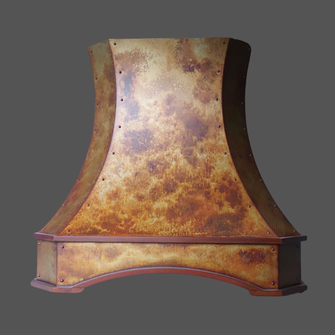 Leathered 2 The Leathered 2 is a rustic metal range hood with a curved, flared shape and weathered patina finish, shown against a plain gray background.