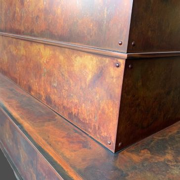 Leathered 3361 A close-up of Leathered 3361 panels, featuring a rusted, weathered metal look with visible rivets and angled joins.