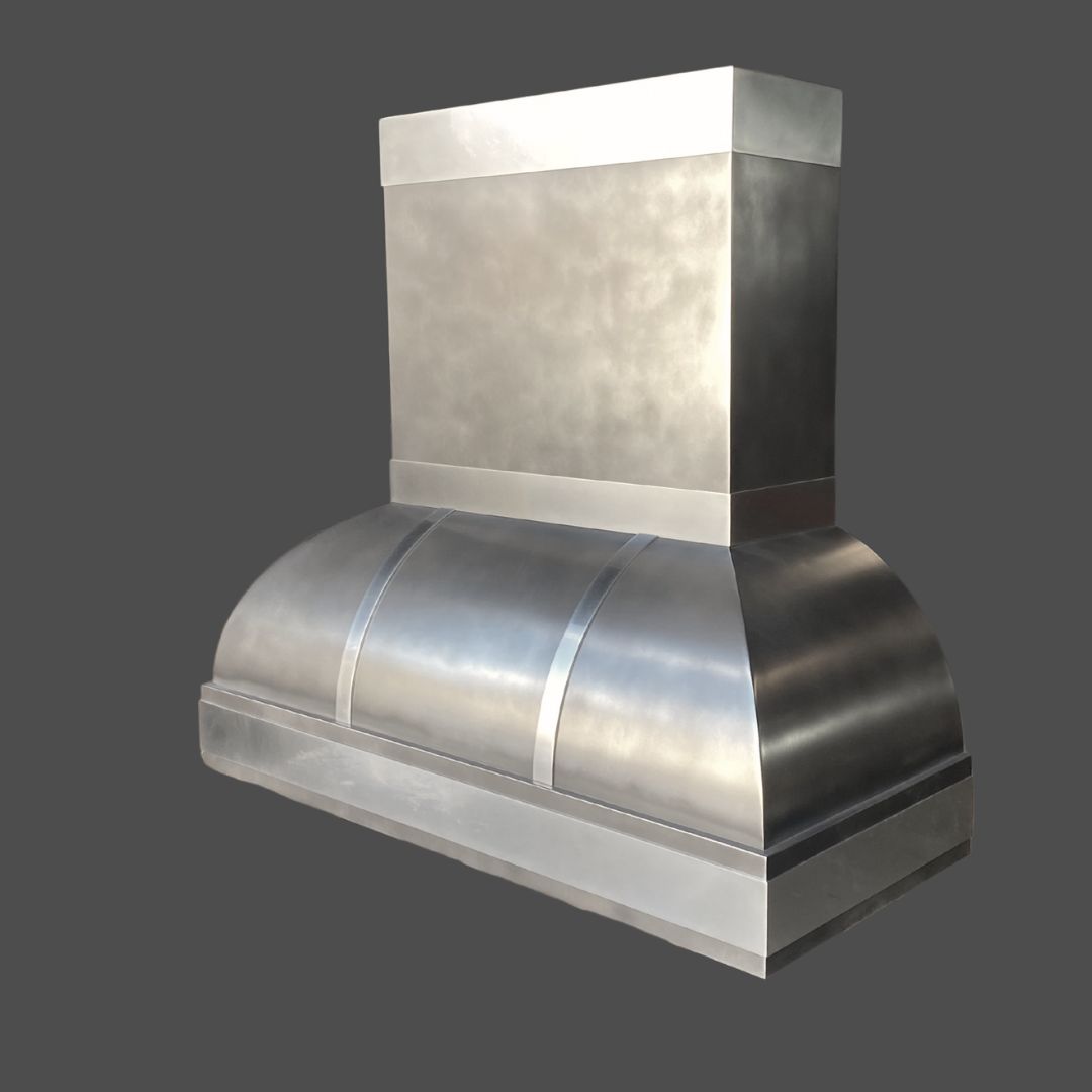 Pewter Antique 1 The Pewter Antique 1 is a large, modern stainless steel kitchen range hood featuring a rectangular upper section and a curved lower section, displayed against a plain gray background.
