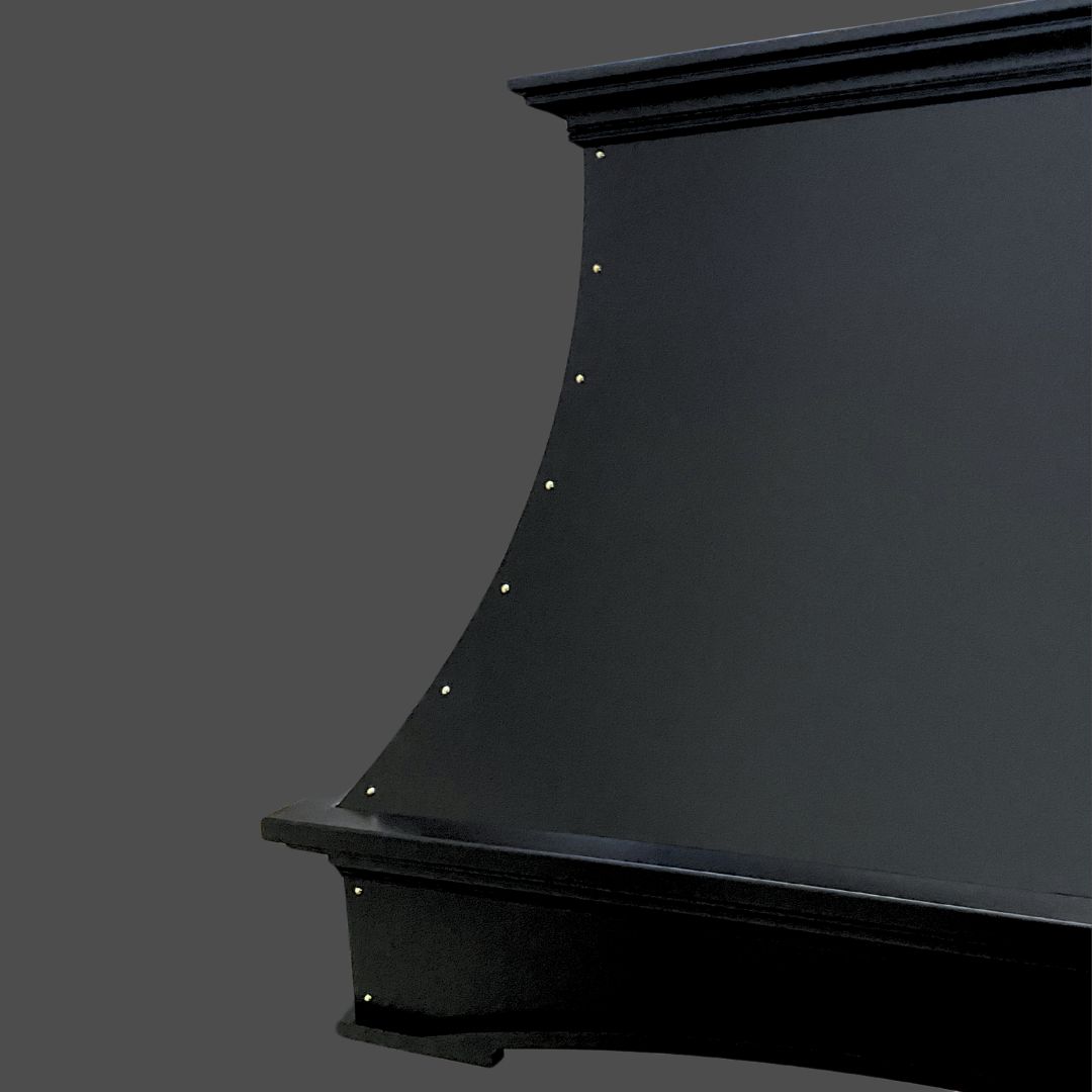 Raven Black 2 A close-up of the curved side of the Raven Black 2 upright piano against a plain gray background, featuring decorative gold-colored rivets along the curve.