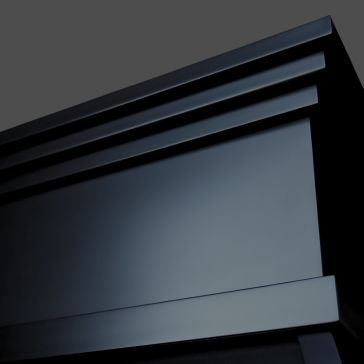 Raven Black 6768 Close-up of the top corner of a Raven Black 6768 glossy grand piano against a dark grey background.