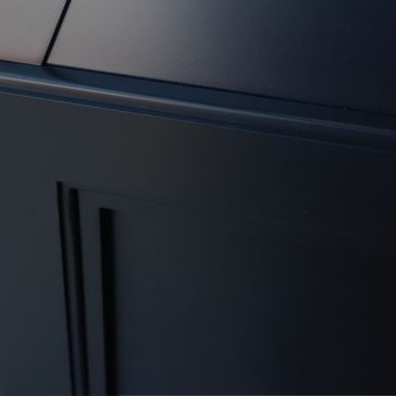 Raven Black 6867 Close-up of Raven Black 6867, a dark, modern surface with clean lines and geometric shapes. Lighting emphasizes its smooth texture and sharp edges, ideal for contemporary appliances or furniture.