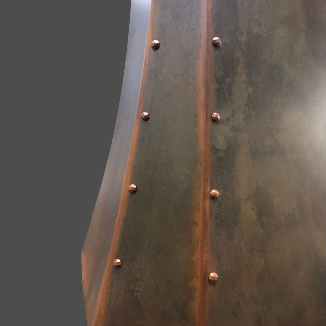 A close-up of Rustic Iron 2 shows a weathered, rusted metal surface with vertical seams and rows of rounded rivets, set against a plain gray background.