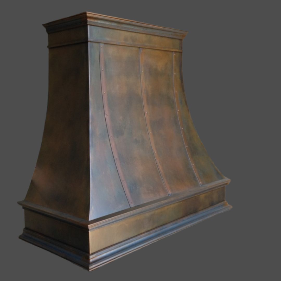 The Rustic Iron 3 is a large, bronze-colored metal range hood with a curved trapezoidal design and visible vertical rivet lines, shown against a plain gray background.