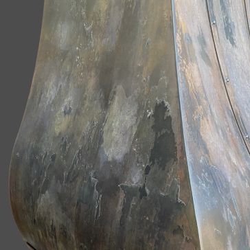 Rustic Reclaimed 2 Close-up of Rustic Reclaimed 2 shows weathered, textured metal with oxidized patches and discoloration in brown, green, and gray tones, resulting in an abstract, mottled look.
