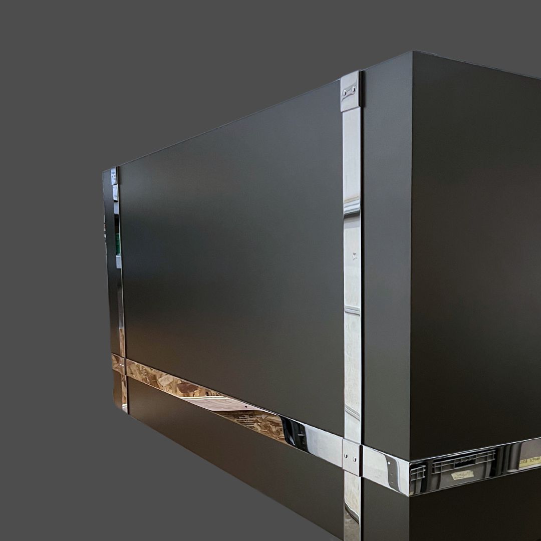 Stainless Polished 2 A large, rectangular Stainless Polished 2 in matte black with shiny metallic trim along its edges, set against a plain gray background.