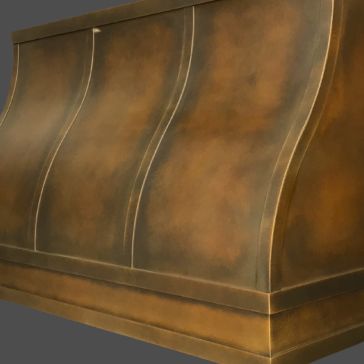 A close-up of the Warm Foundry 6 range hood showcases its metallic bronze finish and curved, fluted design accents against a gray background.