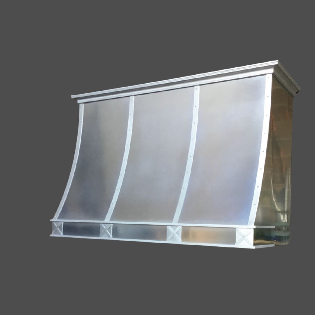 Zinc Burnished 1 The Zinc Burnished 1 is a stainless steel kitchen range hood featuring a curved front design and vertical riveted seams, displayed against a plain gray background.