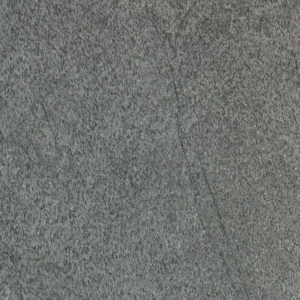 A close-up view of Kosha, showcasing its gray stone surface with a rough, textured look and subtle shading variations.